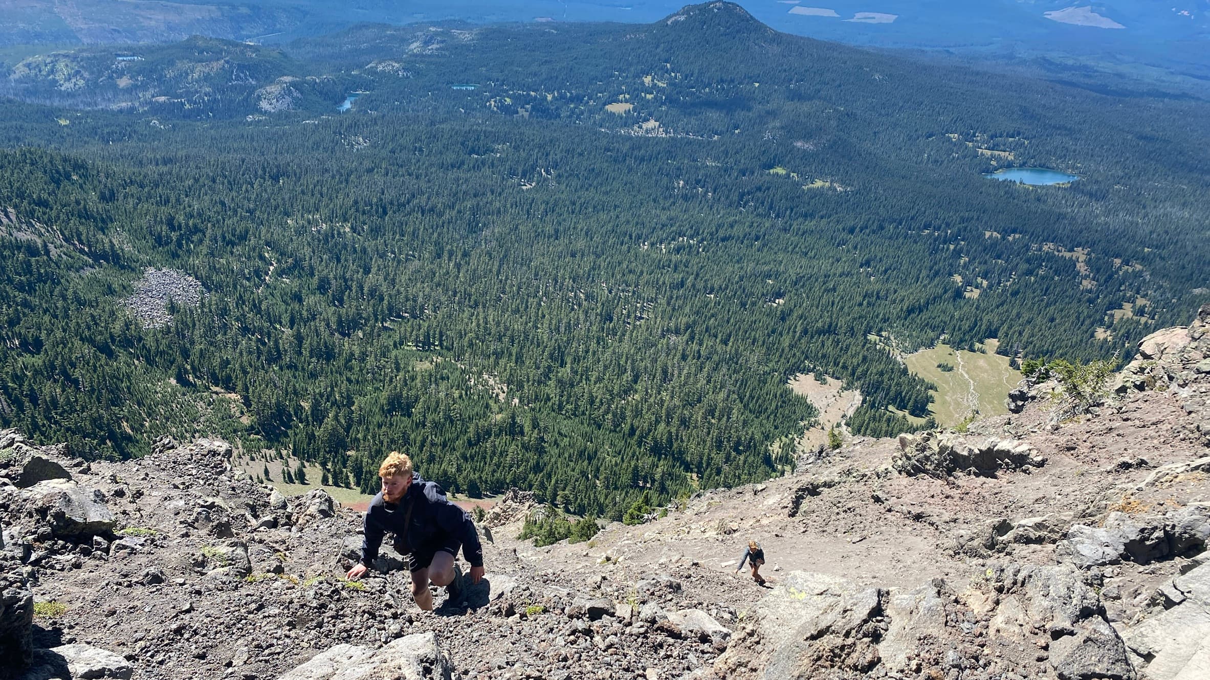 Climbing a steep rocky ridge above the treeline on the PCT